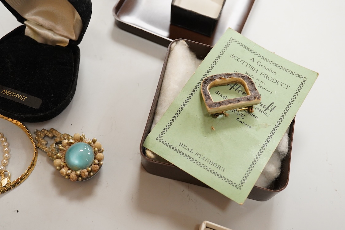 A collection of silver and costume jewellery, including a silver locket, St Christopher ingot pendant and watch chain, and a selection of costume jewels